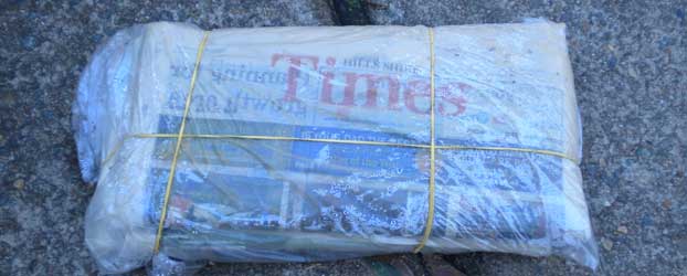 These days, newspapers are delivered in plastic, secured with rubber bands.